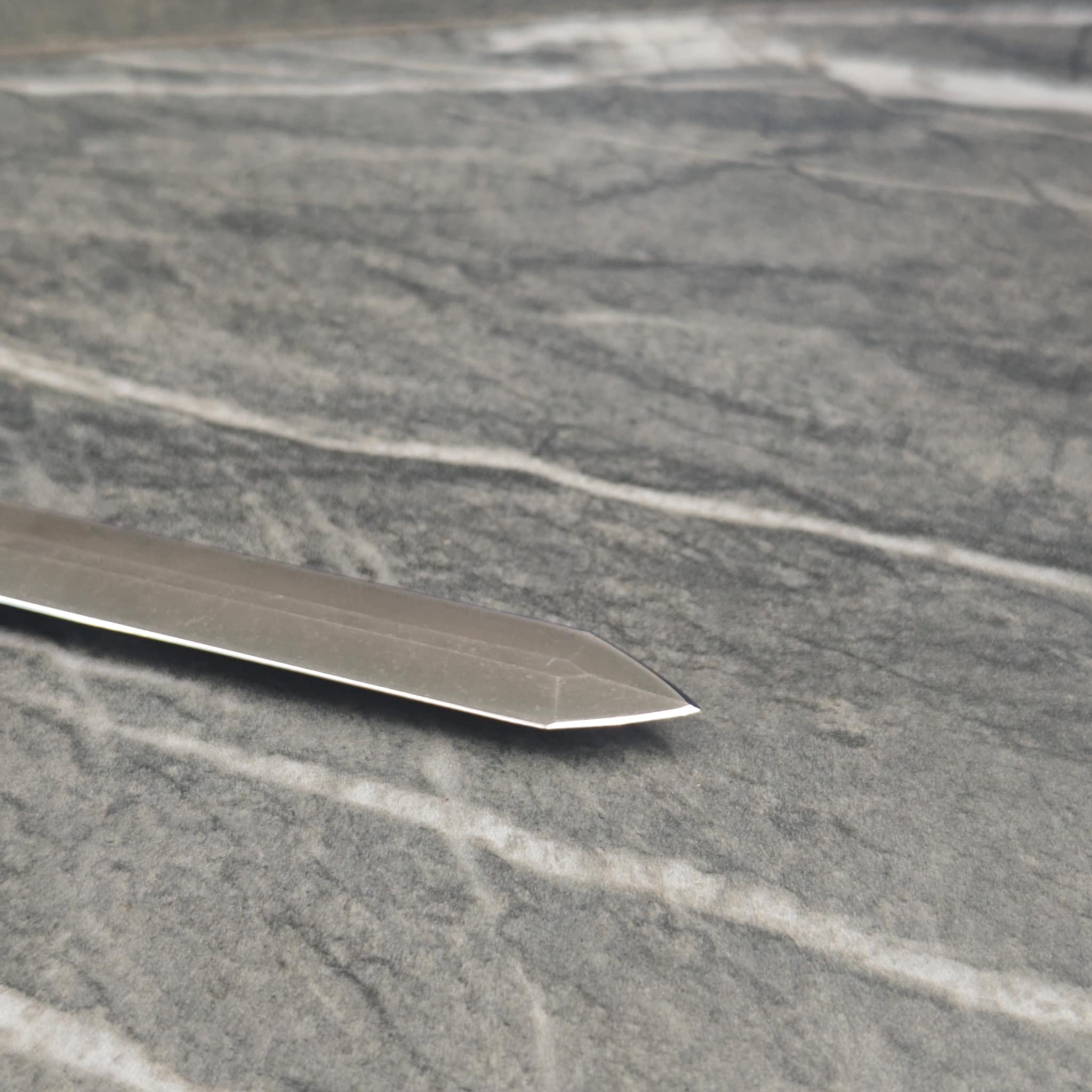 Knife blade polished and sharpened to factory edge