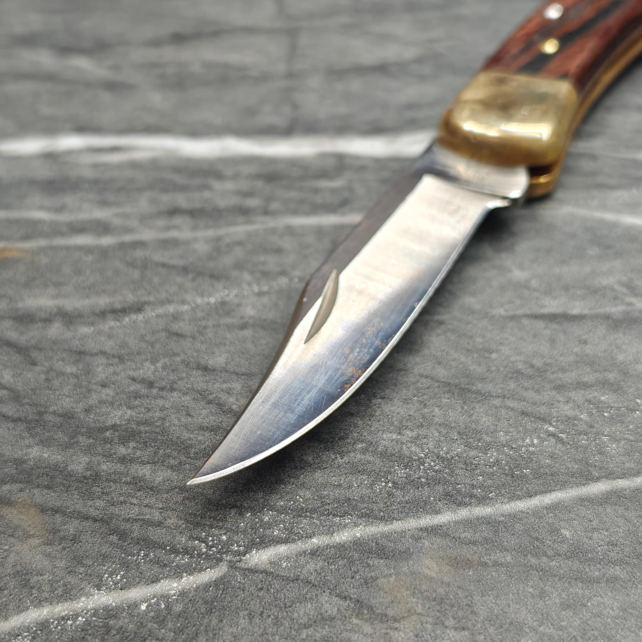 Sharp knife blades arranged on work surface