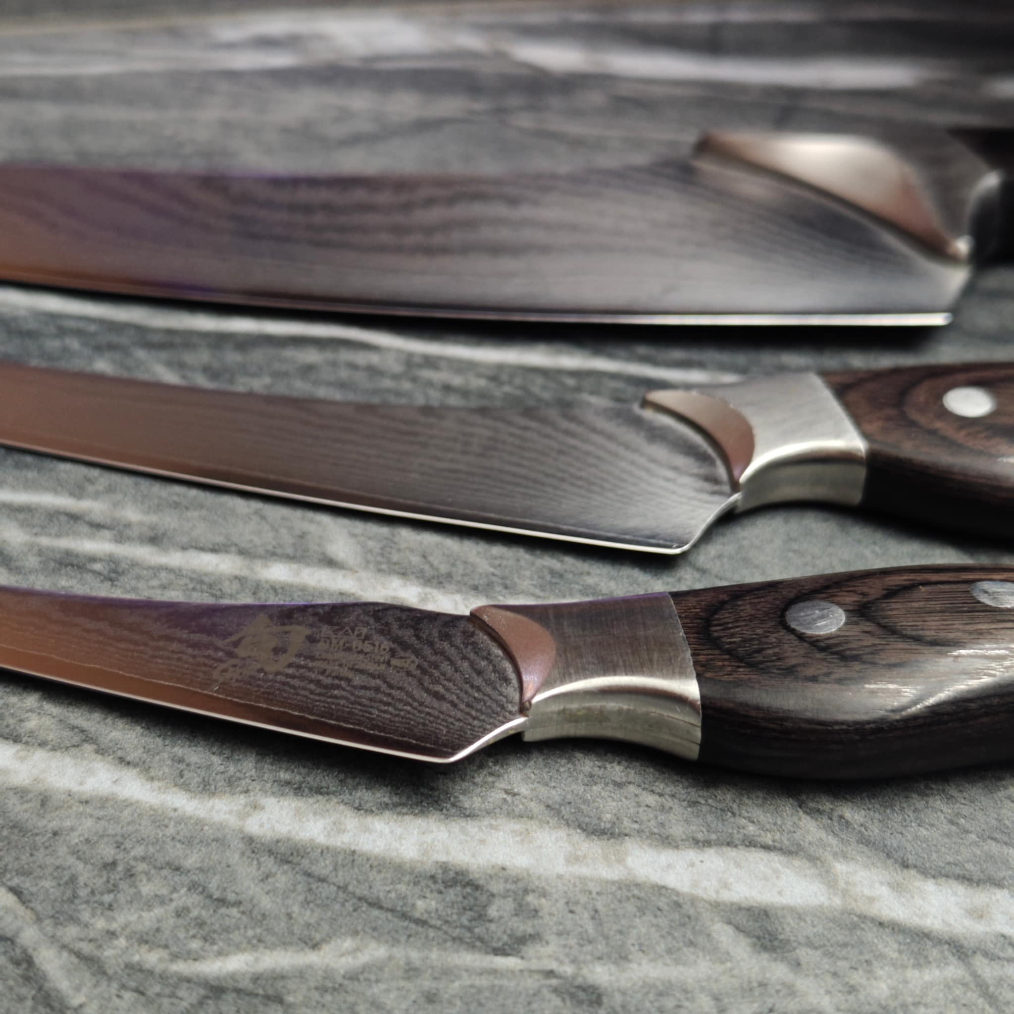 Set of sharpened scissors laid out on work surface