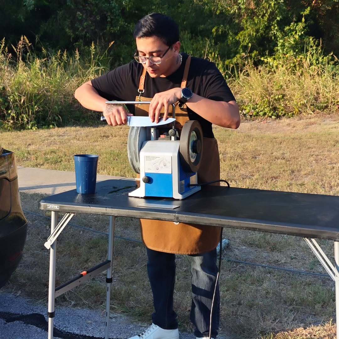 Michael sharpening knives outdoors