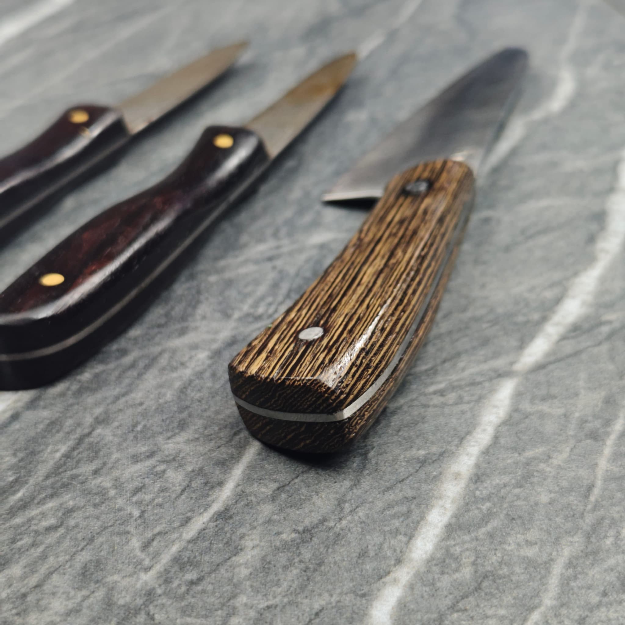 Wooden-handle folding knife sharpened