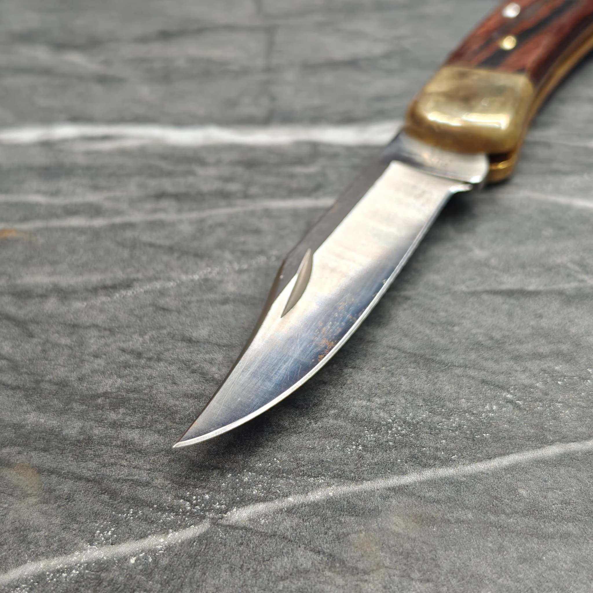 Sharp knife blades arranged on work surface