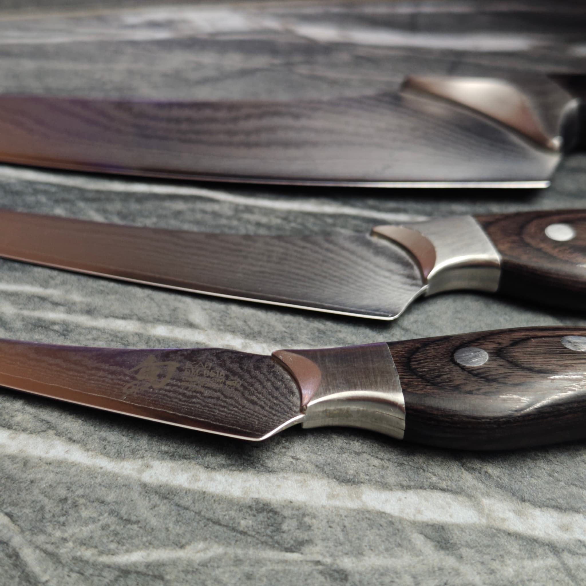 Set of sharpened scissors laid out on work surface