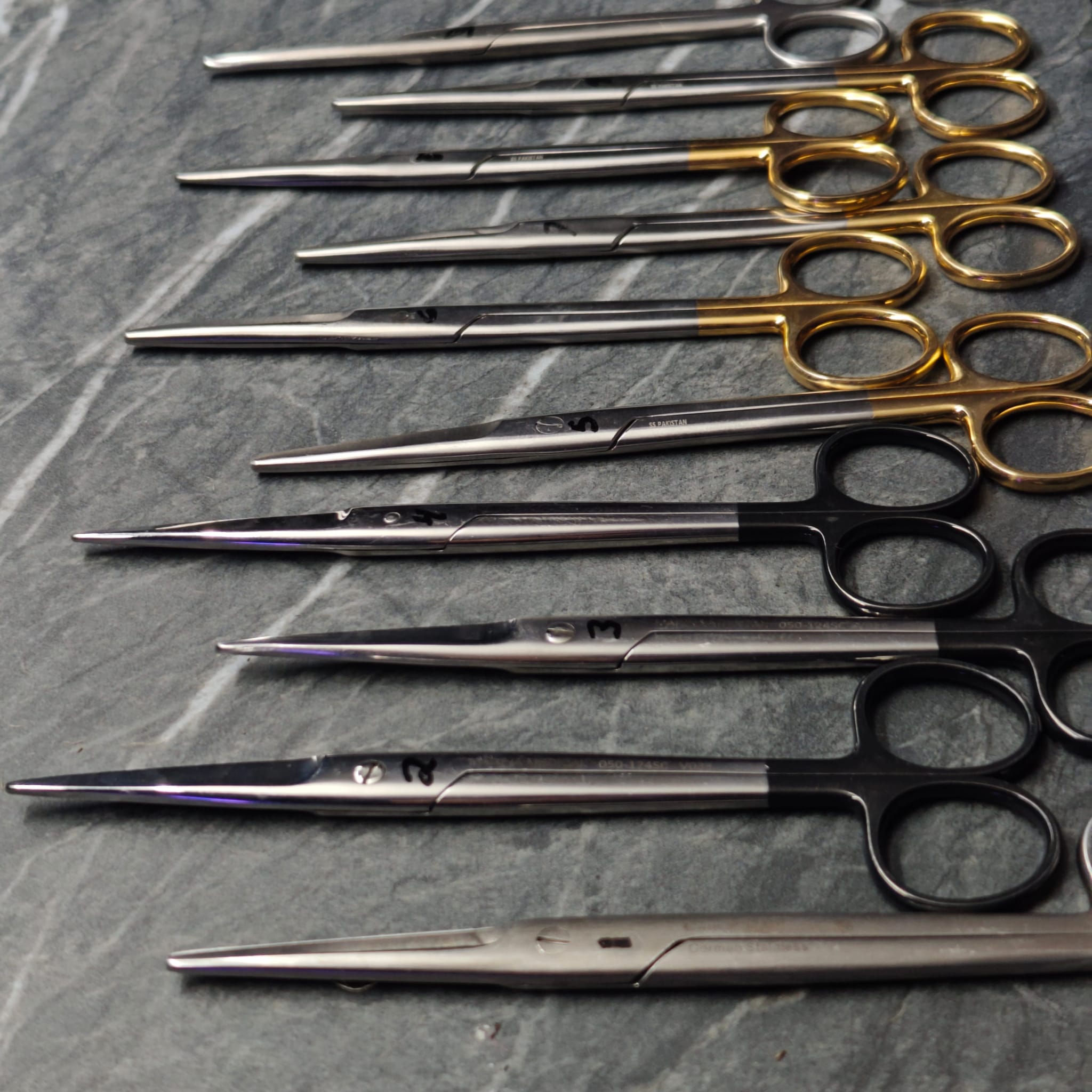 Multiple precision scissors with brass and black handles
