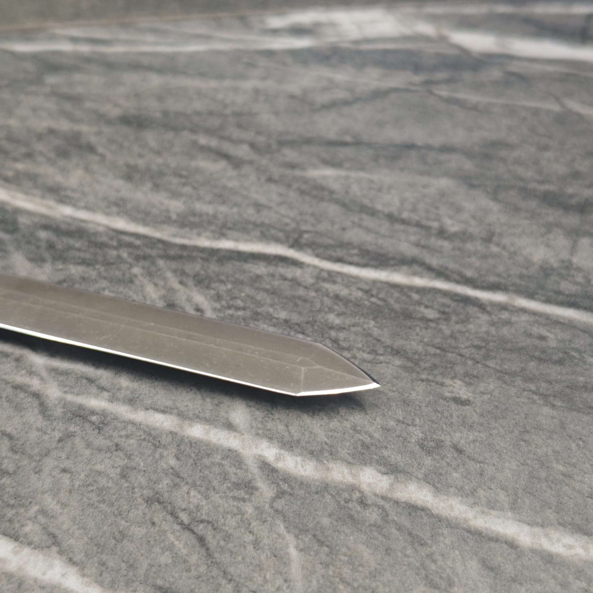 Knife blade polished and sharpened to factory edge