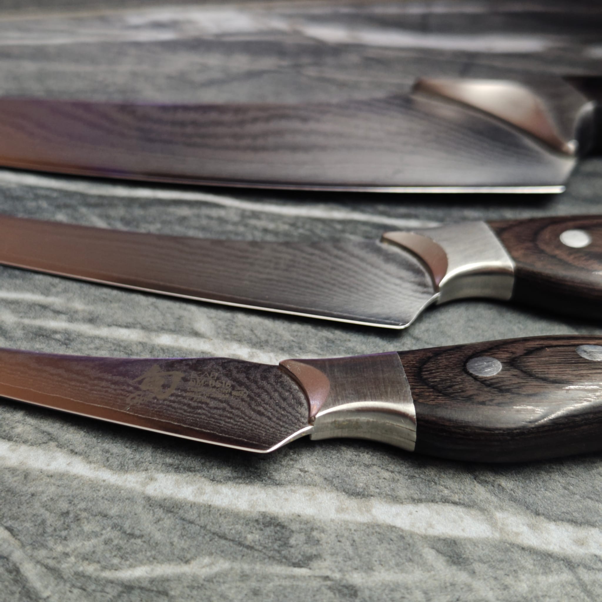 Set of sharpened scissors laid out on work surface