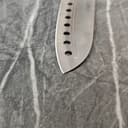 Extreme close-up of razor-sharp knife edge