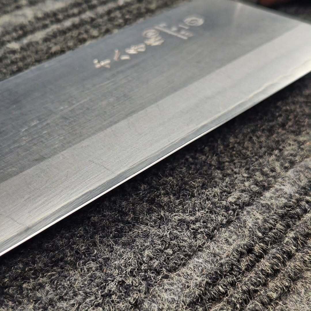 Japanese cleaver edge fully repaired with a smooth, even edge
