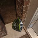 Green SFS bag left at night for porch pickup