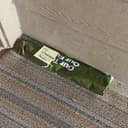Green SFS bag with sticky note left at doorstep for porch pickup