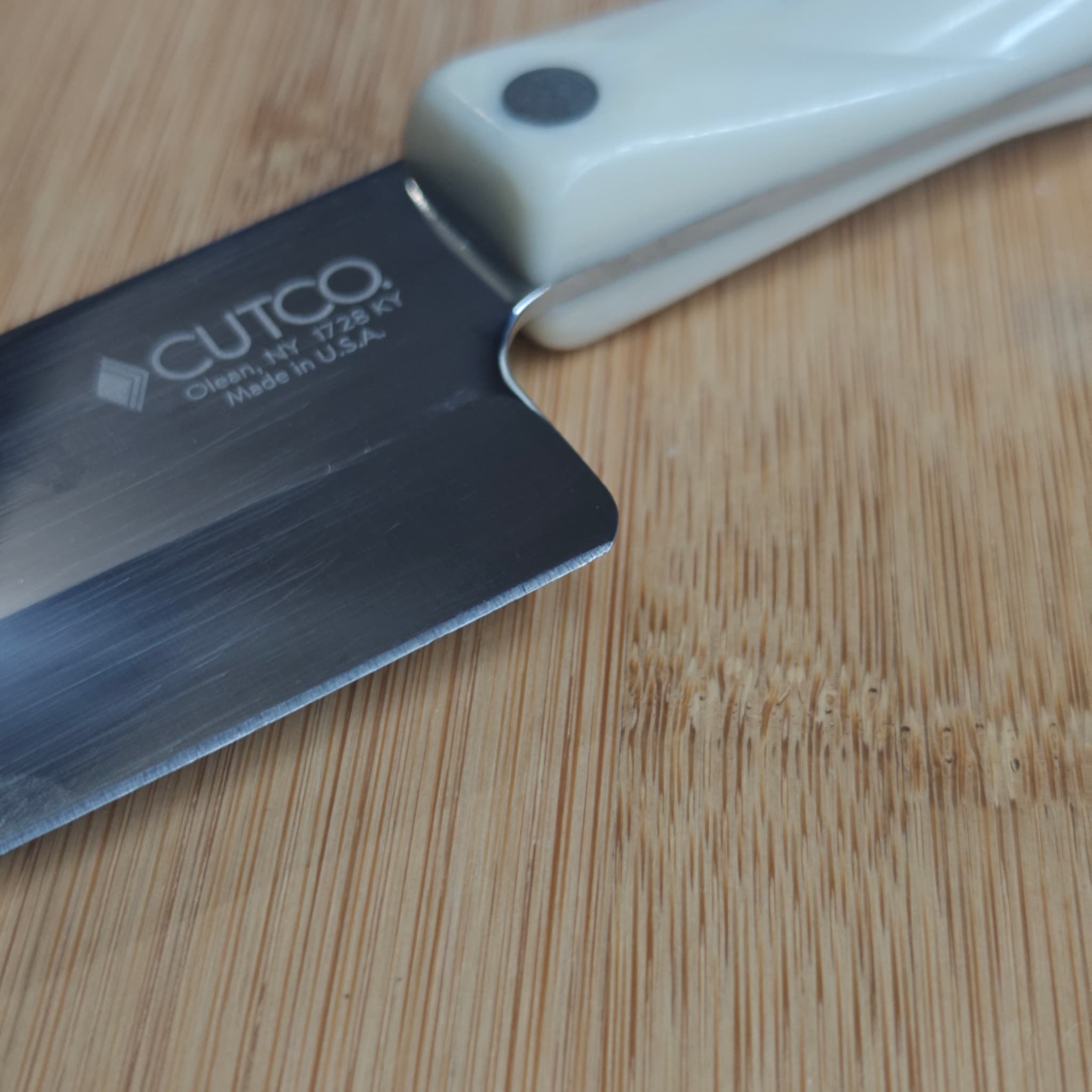 Cutco knife tip closeup — worn tip before professional restoration